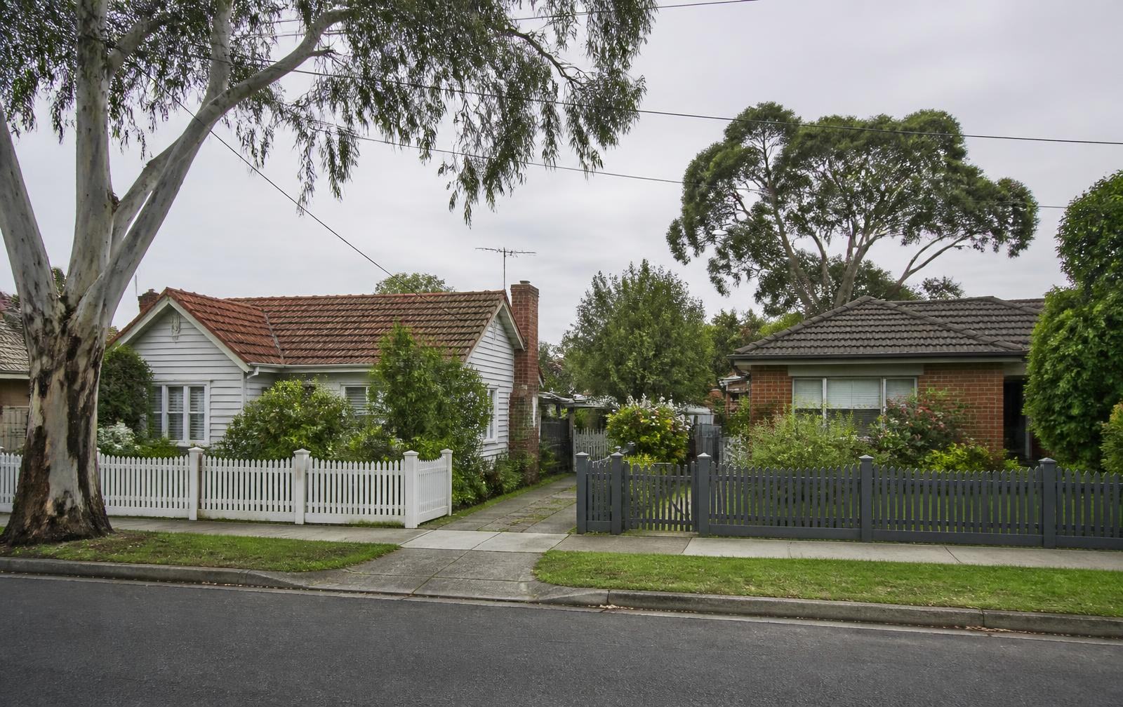 Established weatherboard and brick homes on a quiet Victorian suburban street